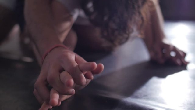 Dancer improvising an intimate dance on the floor