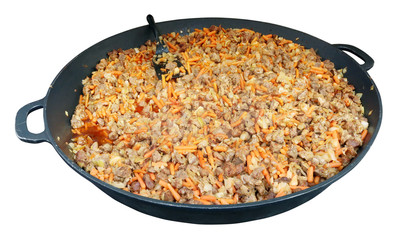 Fast street food - goulash from fat pork stewed with carrots and onions in big frying pan.