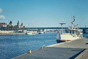 Retro stylized picture of Szczecin (Stettin) city waterfront, Poland.