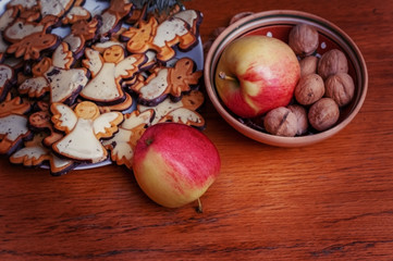 Christmas cookies and fruit on the table.