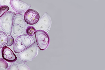 Sliced red onion set, isolated on gray background, top view