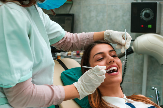 Close up of beautiful young girl having dental check up