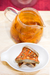 Bael dried and bael juices on wood plate