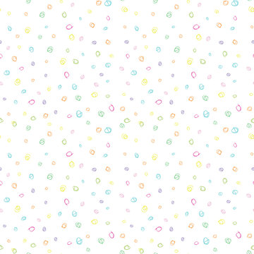 Modern vector seamless pattern with  colorful scribble dots shapes in bright colors. Freehand drawn rounded doodles in pink, purple, blue, green and yellow on white background. 
