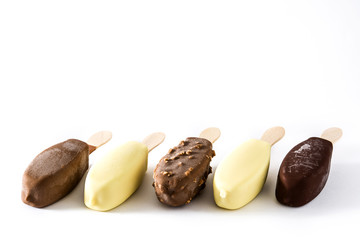 Chocolate ice cream popsicles isolated on white background. Copyspace.
