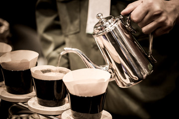 Professional barista preparing coffee alternative method