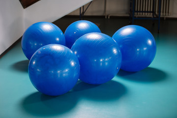 Group of blue pilates balls in the gym