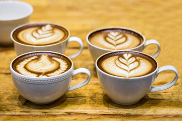 art latte on a cappuccino coffe cup