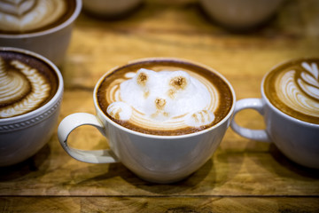 art latte on a cappuccino coffe cup