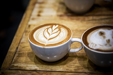 art latte on a cappuccino coffe cup