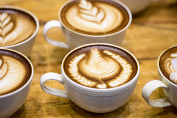 art latte on a cappuccino coffe cup