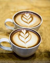art latte on a cappuccino coffe cup