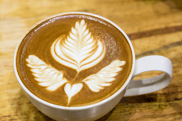 art latte on a cappuccino coffe cup