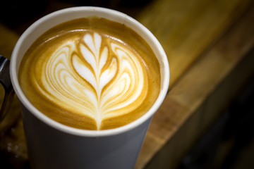art latte on a cappuccino coffe cup