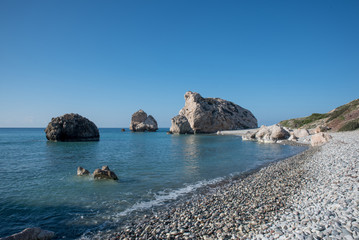 Fototapeta na wymiar PETRA TOU ROMIOU, CYPRUS: Aphrodite's rock and beach near Pafos