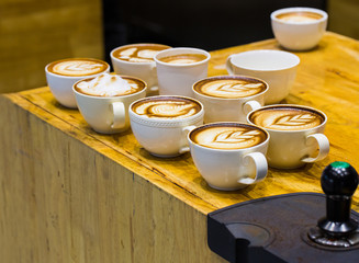 art latte on a cappuccino coffe cup