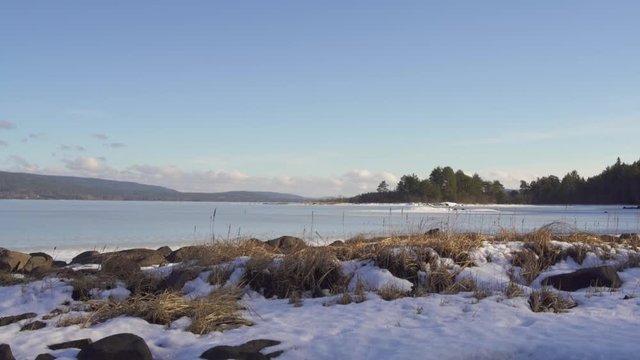 Bank of the frozen Storsjoen lake, Norway, winter