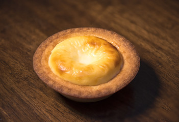 Cheese tart on a wooden table