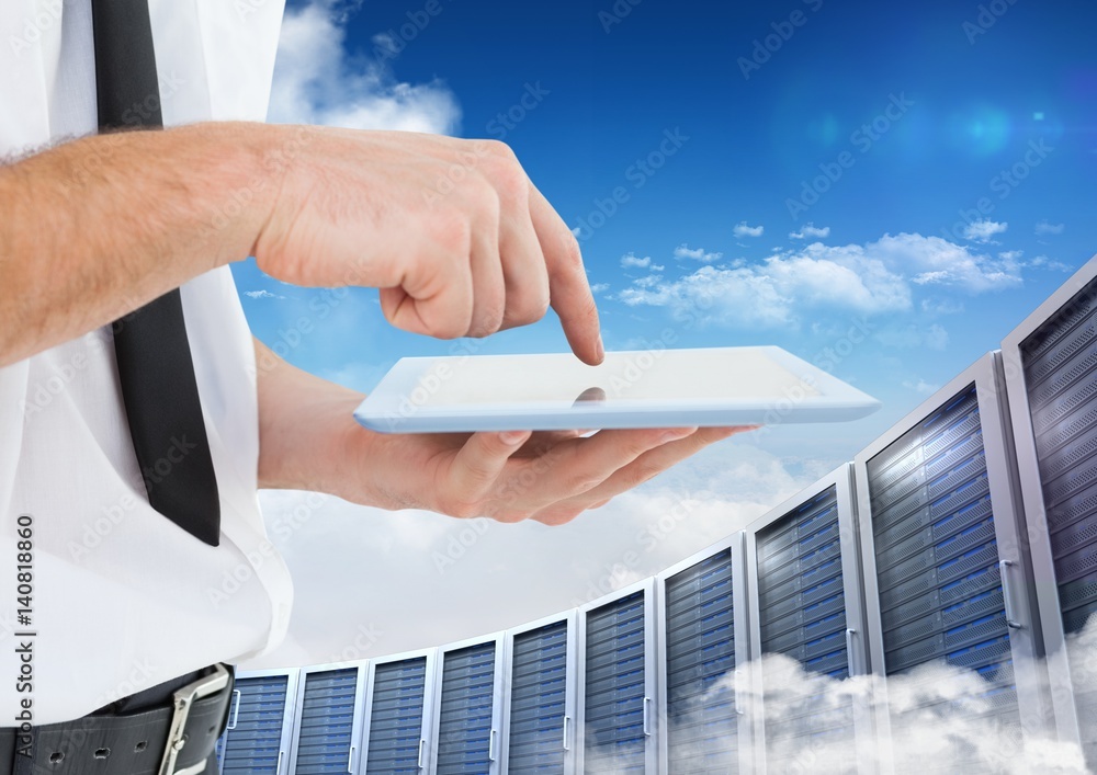 Poster man using digital tablet against office building in background