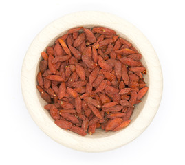 Dried Goji berries in wooden bowl