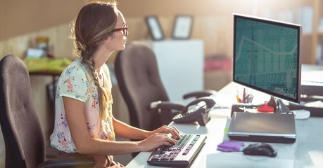 Female graphics designer using computer - Powered by Adobe