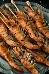 Delicious grilled shrimp with lemon, spices and sauce