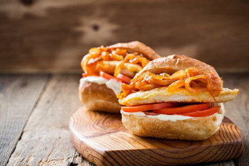 Sandwiches with fried chicken breast and onion sauce