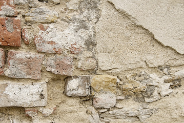 Old beige stone wall background texture