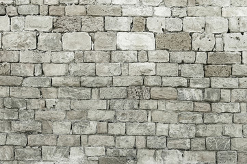 Old grey stone wall background texture