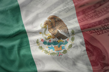 colorful waving national flag of mexico on a american dollar money background. finance concept