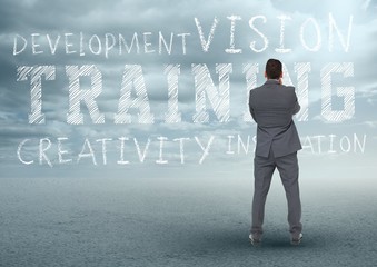 Rear view of businessman looking at motivational concept - Powered by Adobe