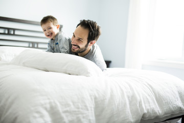 Father and son in bed, happy time on bed