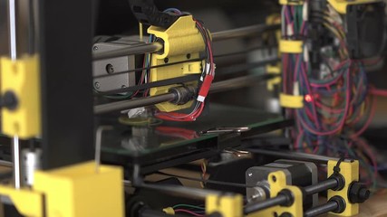 3D printer at work. 3D printing, additive manufacturing (AM), refers to processes used to create a three-dimensional object in which successive layers of material are formed under computer control - Powered by Adobe