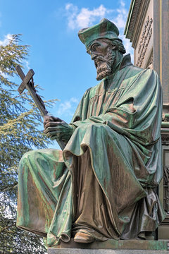 Statue of Jan Hus, an element of the Martin Luther Monument in Worms, Germany. The monument was unveiled in 1868. Text behind the statue reads: Here I stand, I cannot do otherwise. God help me! Amen!