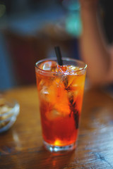 Refreshing traditional drinks on wooden table Aperol Spritz and sparkling water.