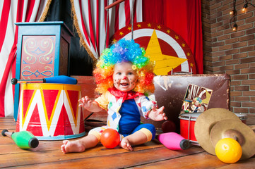 Little baby clown with red nose multi-colored wig in with balls © Yarkovoy