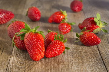 Strawberries, rustic wood