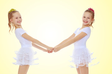 Cute girls holding hands