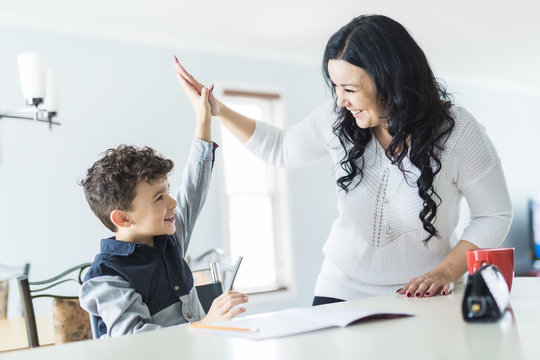 Mother Helping Son for the Homework at home