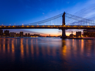 Fototapeta na wymiar Bridge silhouetted against dawn sky