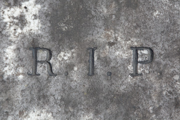 RIP. Rest in peace. Traditional inscription on the grave.