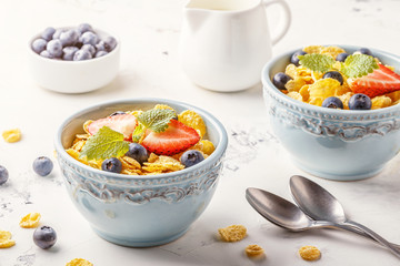 Healthy breakfast - corn flakes with fruits and berries.
