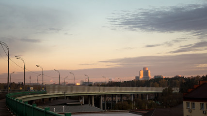 Fototapeta na wymiar Highway overpass with city background .