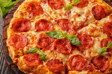 Pepperoni pizza with mozzarella cheese and tomato sauce