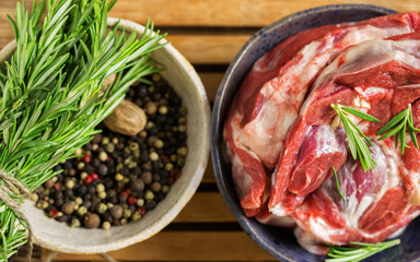 Raw fresh meat Striploin steak and seasoning on dark wooden background