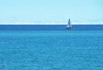 Fototapeta premium Distant Sailboat
