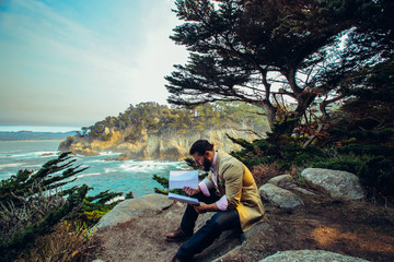 Man Reading Script on California Coastline