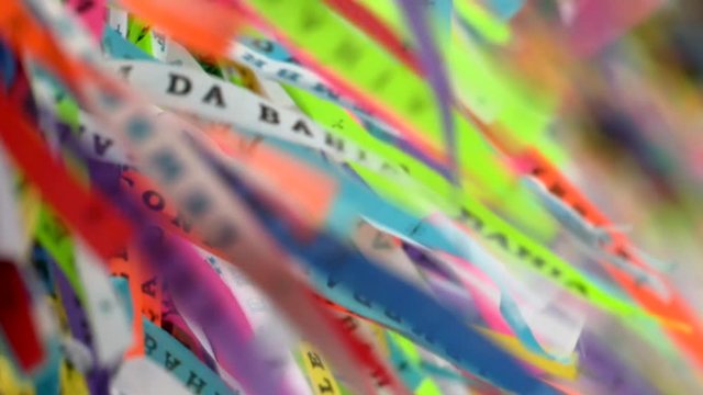 Colorful Brazilian wish ribbons tied on church fence in Salvador, Bahia. Traditional Fita do Bonfim in front of Church entrance