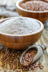 Buckwheat flour in a wooden bowl.