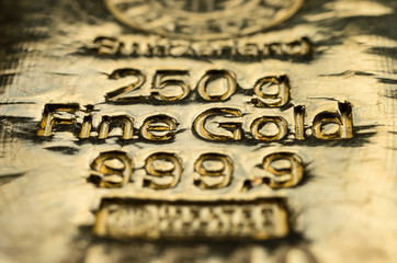 The surface of cast gold bullion. Selective focus.  (shallow DOF)